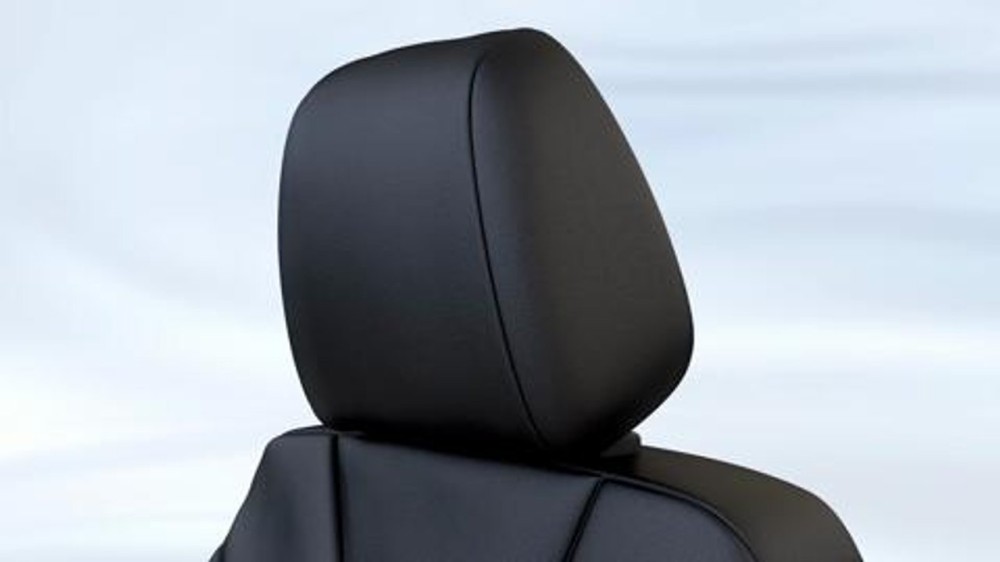 car headrest pushes head forward